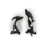 Two Oriental unusual carved fruitwood Figures of Birds of prey resting on branches, of