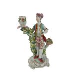 A very good 18th Century flower encrusted Derby Figural Candlestick, 25cms high. (1) Provenance: The