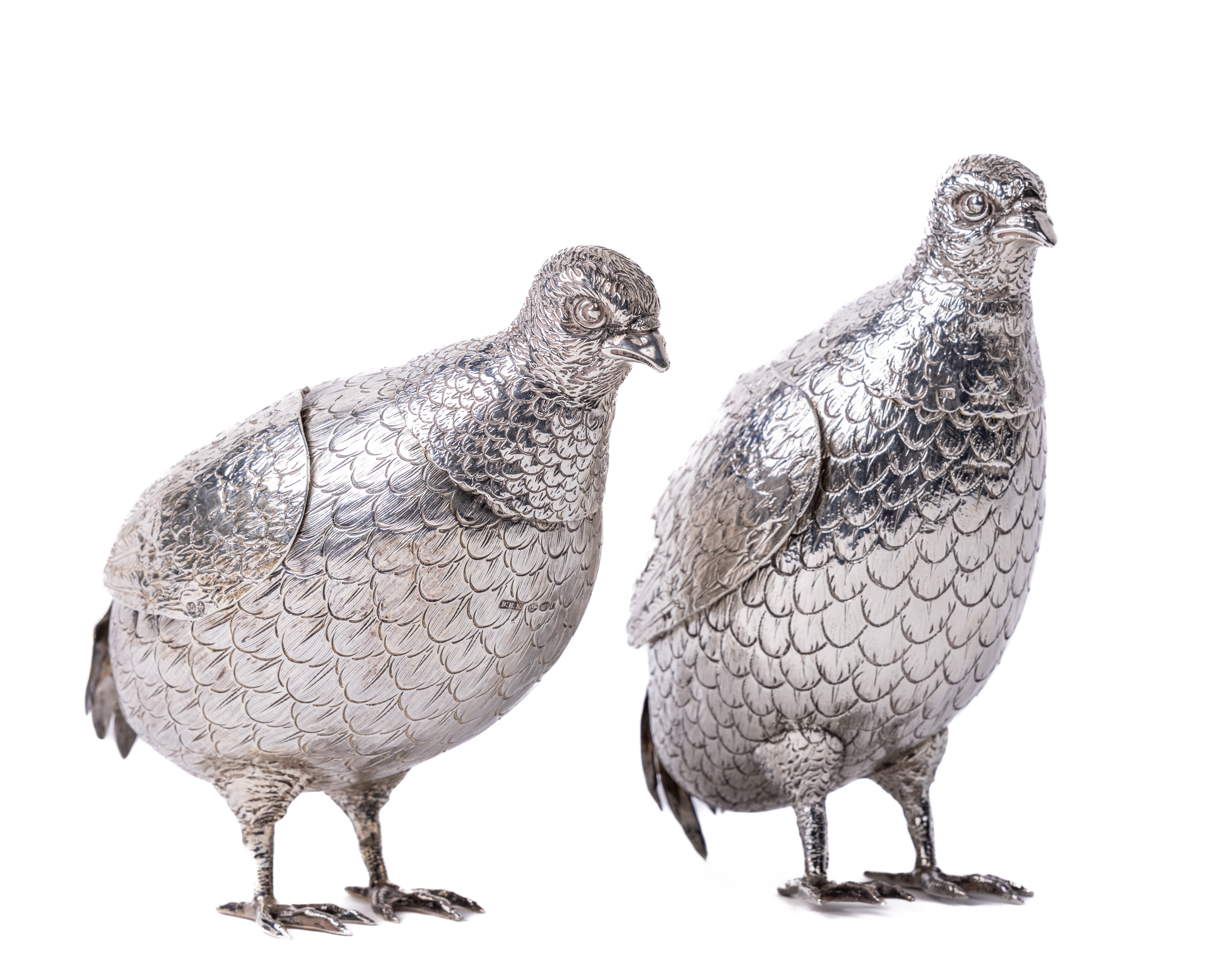 A quality pair of Victorian Sterling silver cast models of Partridges, made by Berthold Muller, with