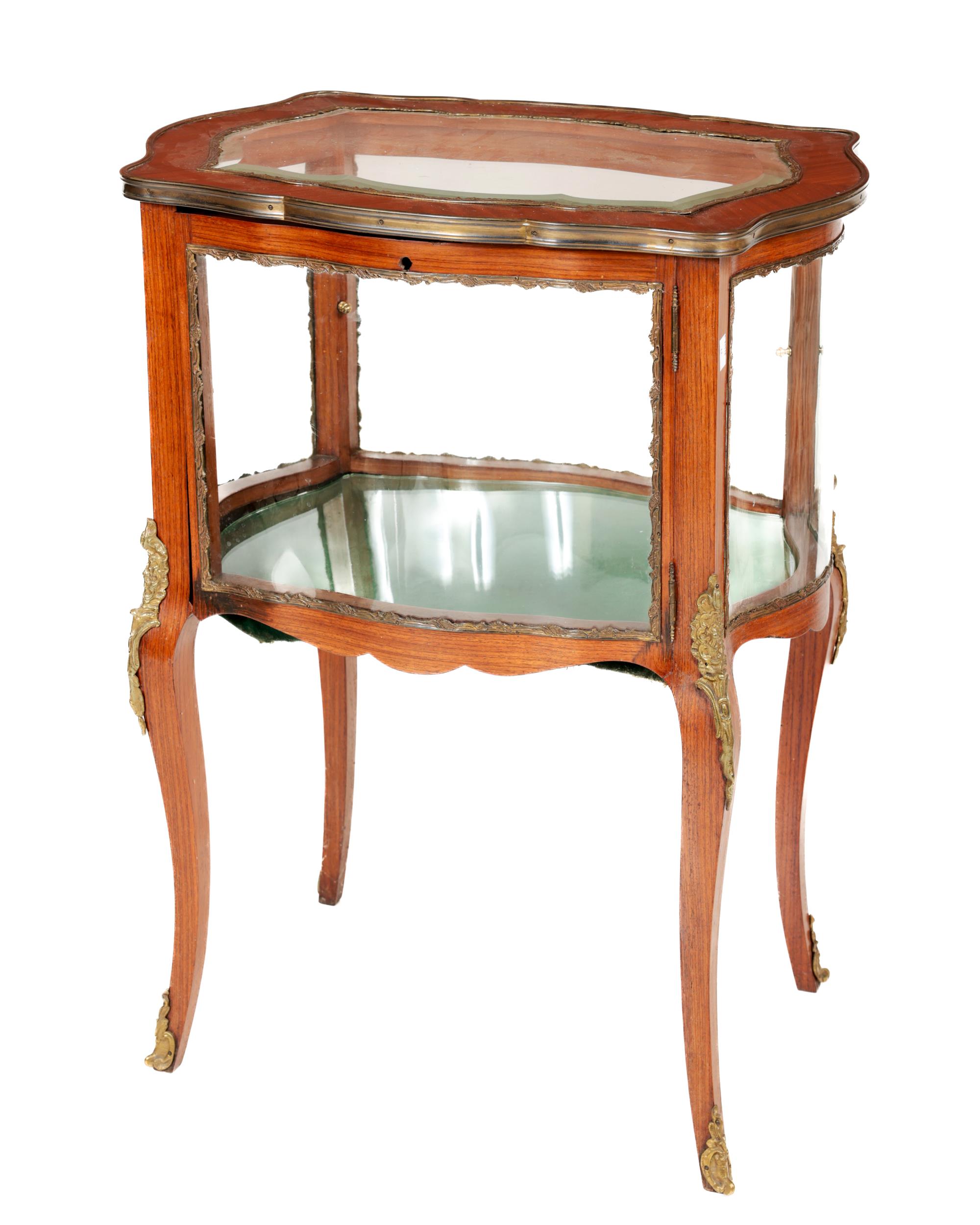 A fine quality French style kingwood Display Cabinet, the shaped top with panelled glass, ormolu