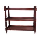 An Irish William IV mahogany three tier Dumbwaiter, with reeded pillar supports and curved finials