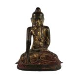 An important 18th Century heavy bronze polychrome and gilt Figure of a seated Buddha, with typical