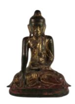 An important 18th Century heavy bronze polychrome and gilt Figure of a seated Buddha, with typical