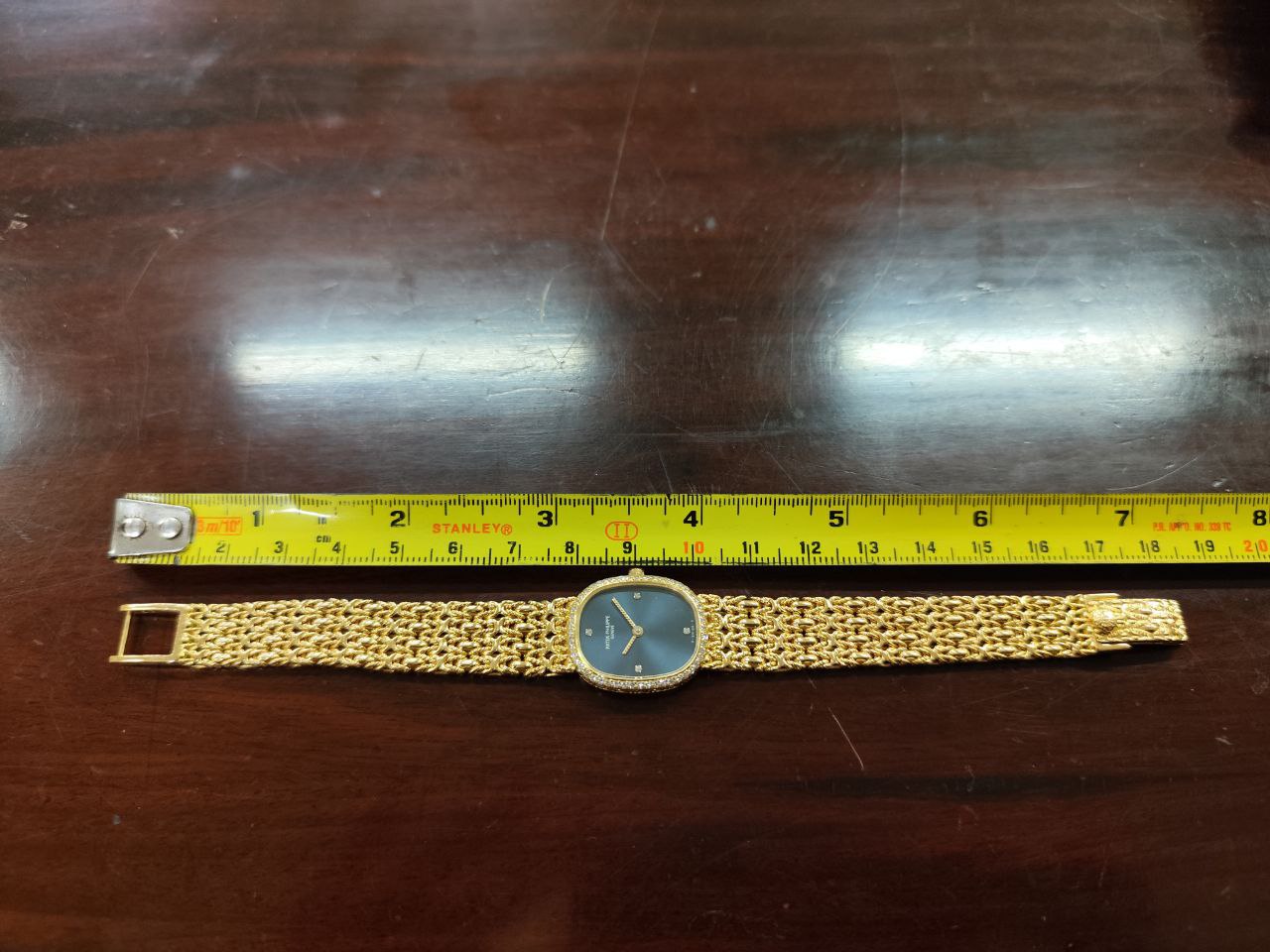 A Ladies Patek Philippe 18ct gold Wrist Watch, the sapphire and face set with four diamonds on the - Bild 9 aus 9