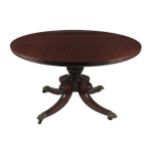 A good quality Regency period mahogany pod Table, with moulded edge, on a carved bulbous pillar,