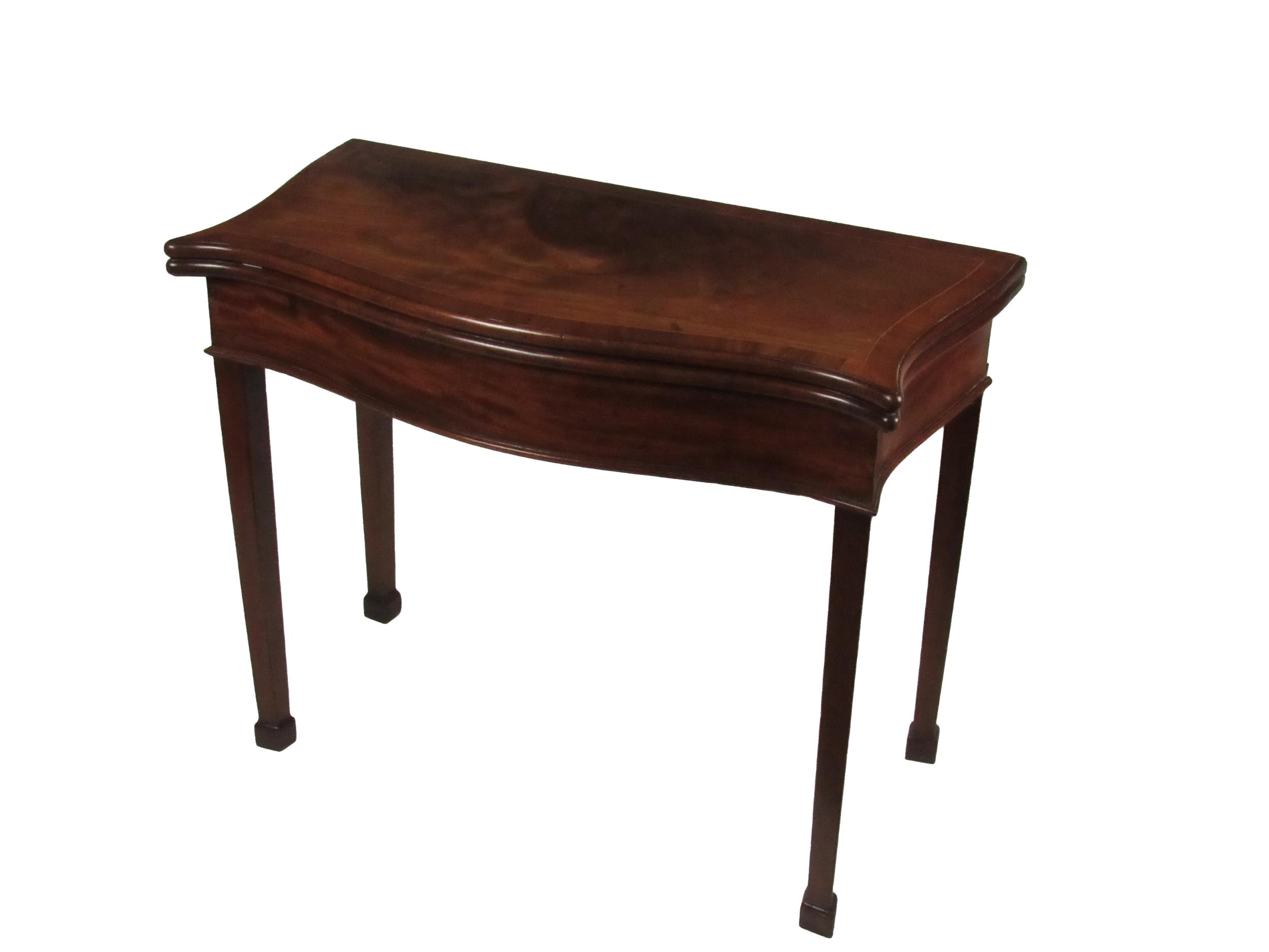 A Georgian mahogany serpentine shaped fold-over Card Table, the top with string inlay, opening to