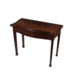 A Georgian mahogany serpentine shaped fold-over Card Table, the top with string inlay, opening to