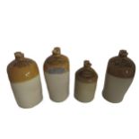 A collection of 4 Earthenware Irish and other Spirit Jars, for Woodford Bourne and Co. Limerick