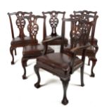 A set of 12 (10 + 2) Irish Chippendale style Dining Chairs, in the manner of Butler, Dublin, each