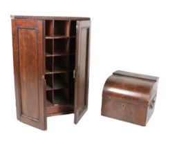 A 19th Century mahogany table top Cabinet, with panelled doors opening to reveal a series of