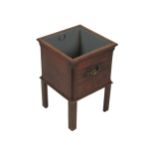 A Georgian mahogany Jardiniere, of square form with ornate brass carrying handles on chamfered legs,