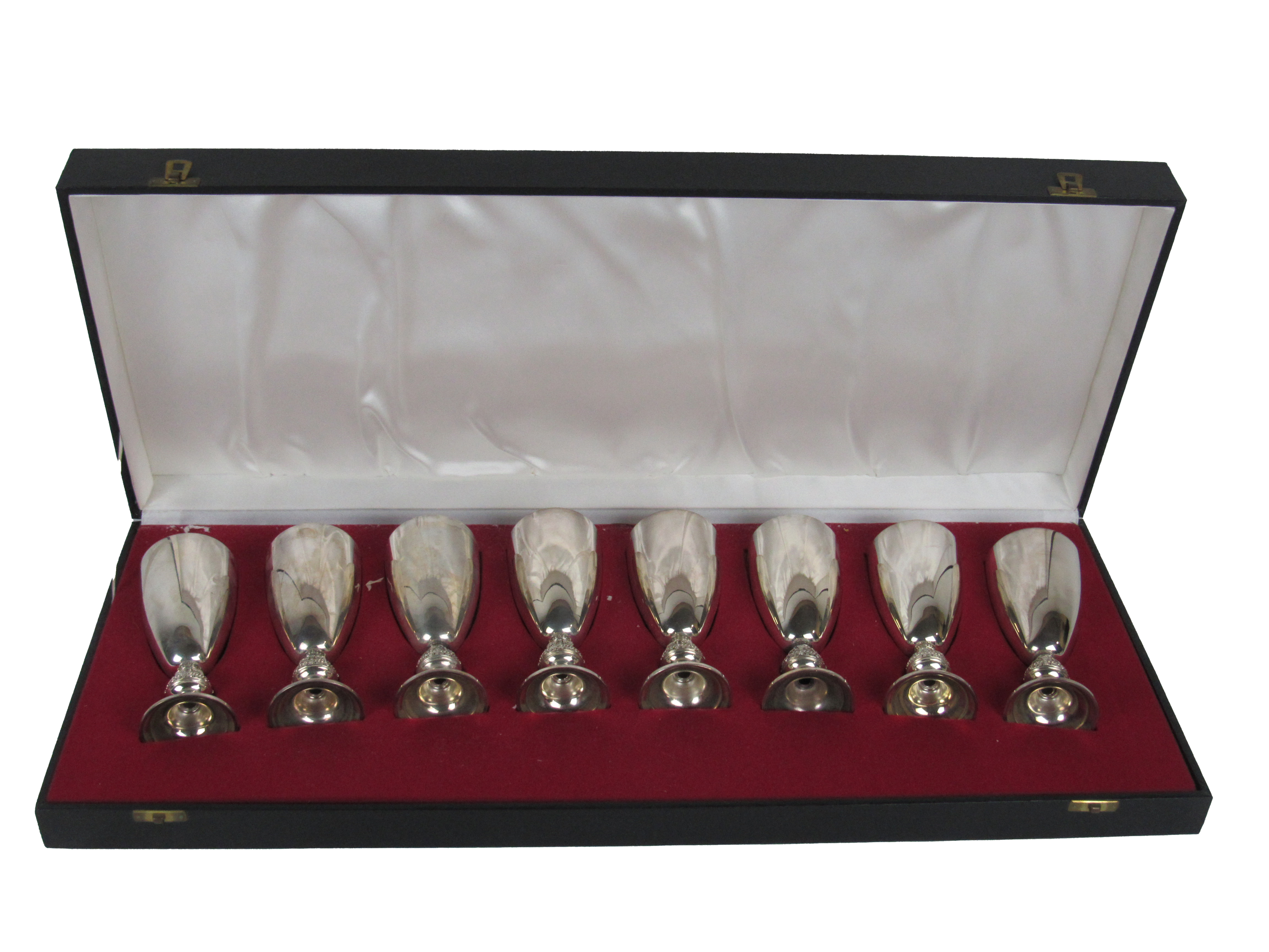 A cased set of 8 Irish silver gilt Wine Goblets, decorated in the Celtic Revival taste by Irish