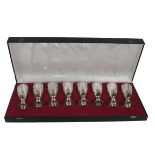 A cased set of 8 Irish silver gilt Wine Goblets, decorated in the Celtic Revival taste by Irish