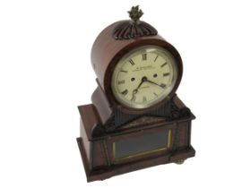 A very fine quality Regency period English Bracket Clock, the circular top with brass flame finial