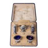 A cased English silver Condiment Set, comprising salt and pepper shakers, mustard pot, and pair of