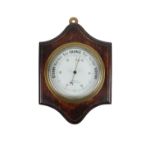 A heavy late 19th Century circular brass Maritime Barometer, with enamel face, signed F.M. Moore,