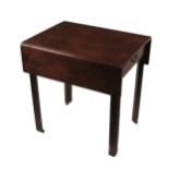 A Georgian Irish Provincial mahogany drop-leaf Table, the plain top with rectangular flaps over a