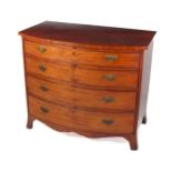 A Georgian mahogany bow fronted Chest of Drawers, the plain top over four long drawers with ornate