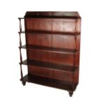 An attractive 19th Century Irish mahogany Waterfall Open Bookcase, with shaped panelled top above