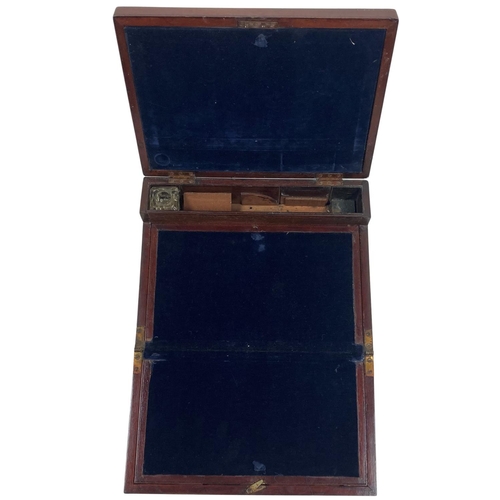 An early 19th Century mahogany Lap Desk, with concealed brass handles and fold out writing