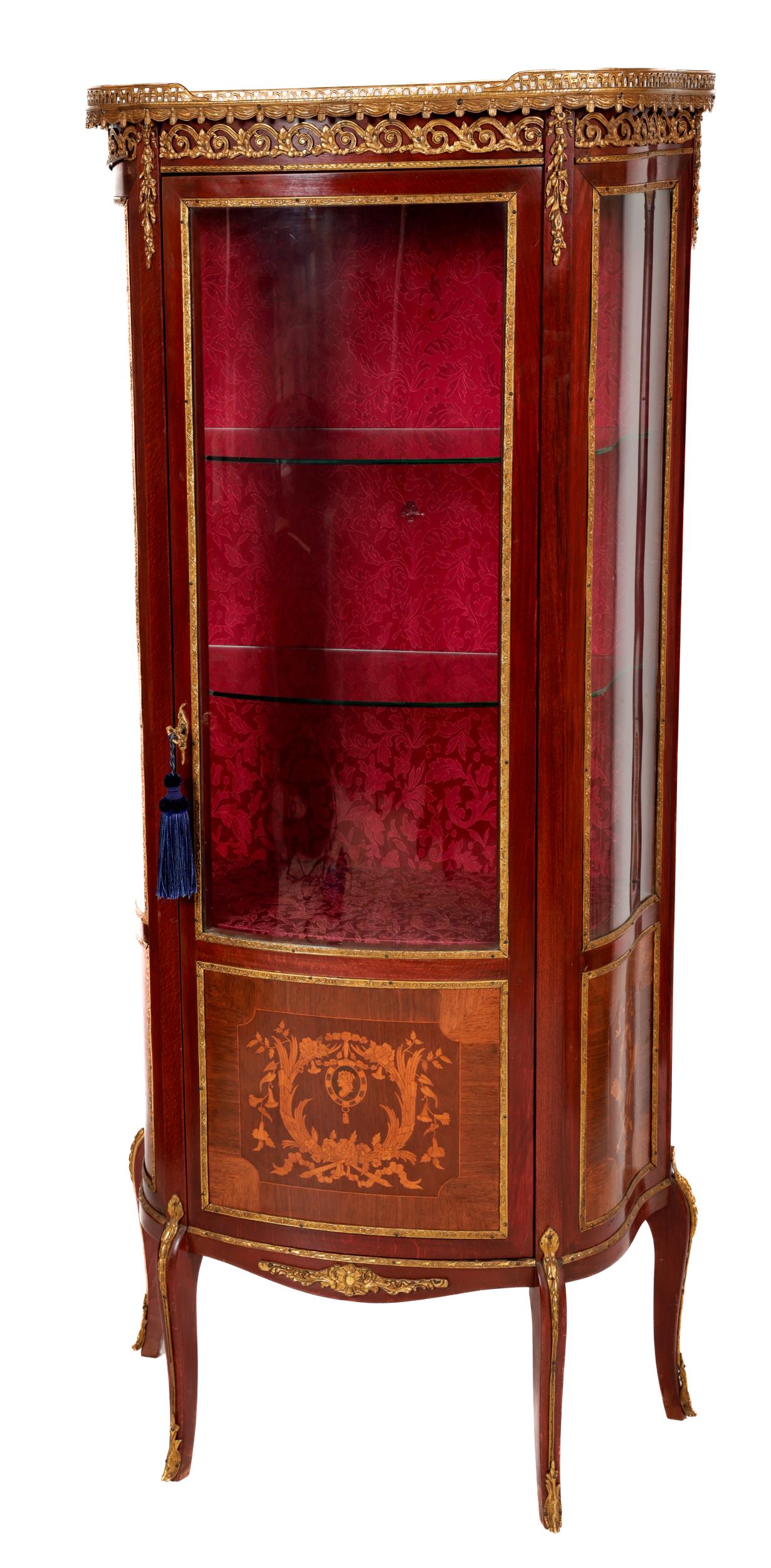 A French Louis XVI style Vitrine, the pierced gallery top over frieze with ormolu mounts, the