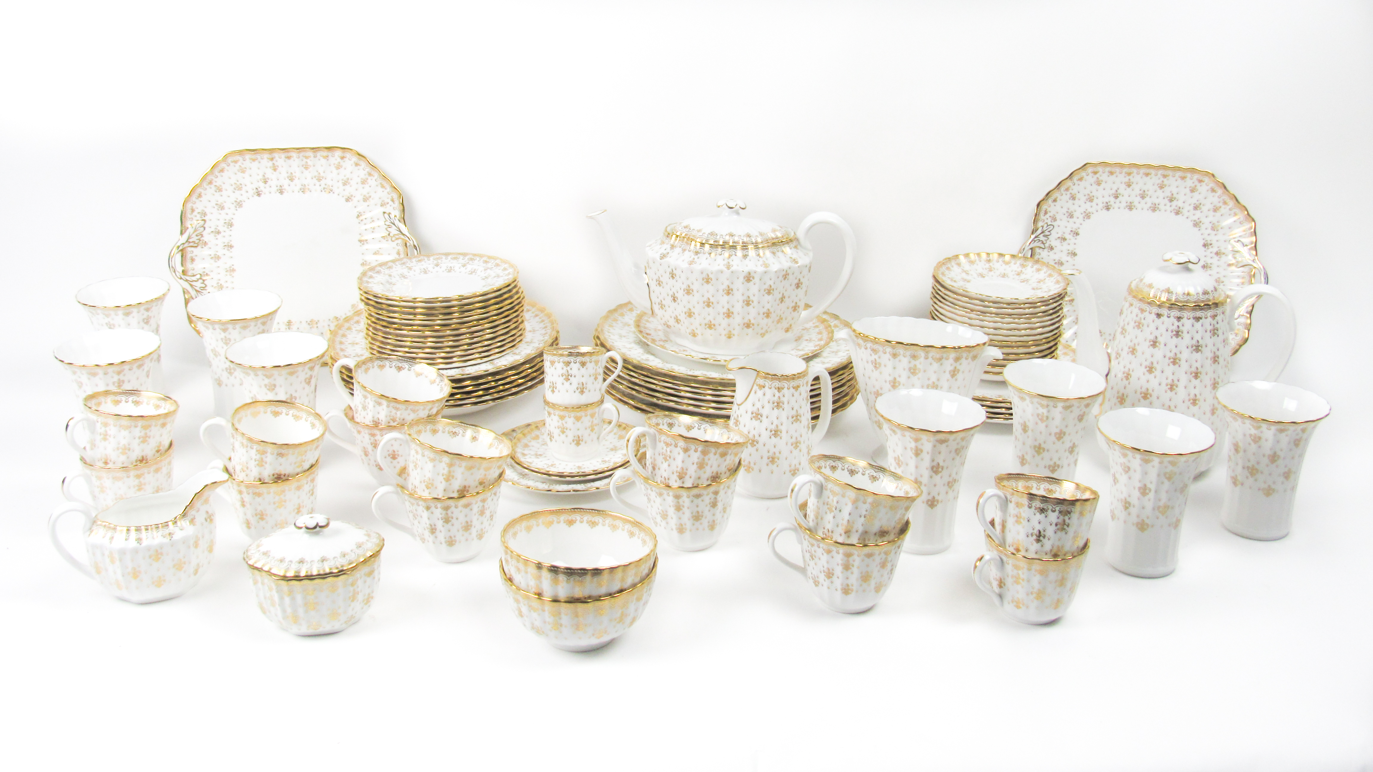 A collection of 'Fleur de Lys' gold pattern design Spode Firebone China, comprising Tea & Coffee