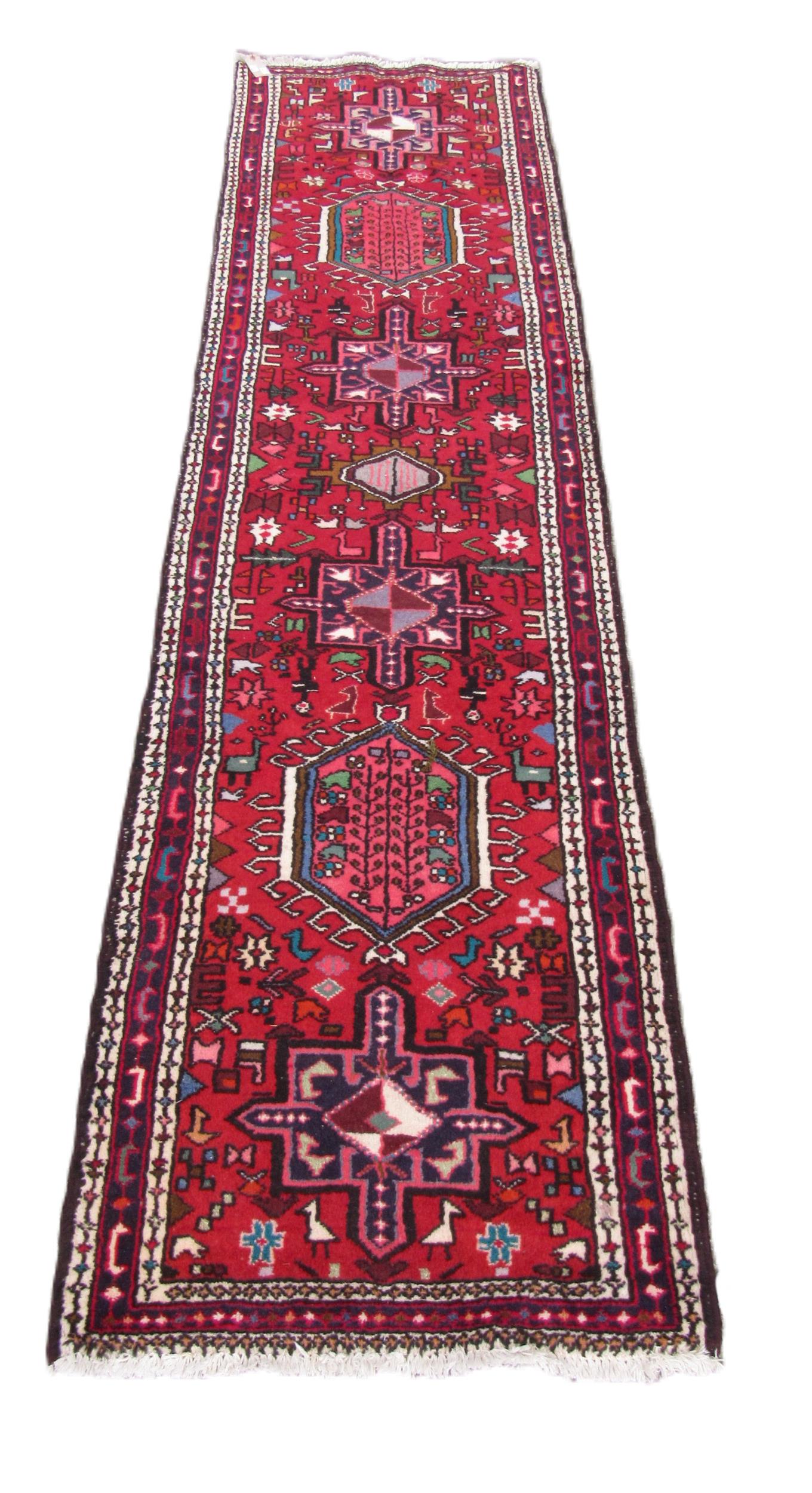 An antique Middle Eastern (Iranian) woolen Carpet Runner, the central panel with geometric lozenges,