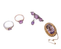 A Victorian 9ct gold Brooch, set with seed pearl border and large central amethyst stone; a 9ct gold