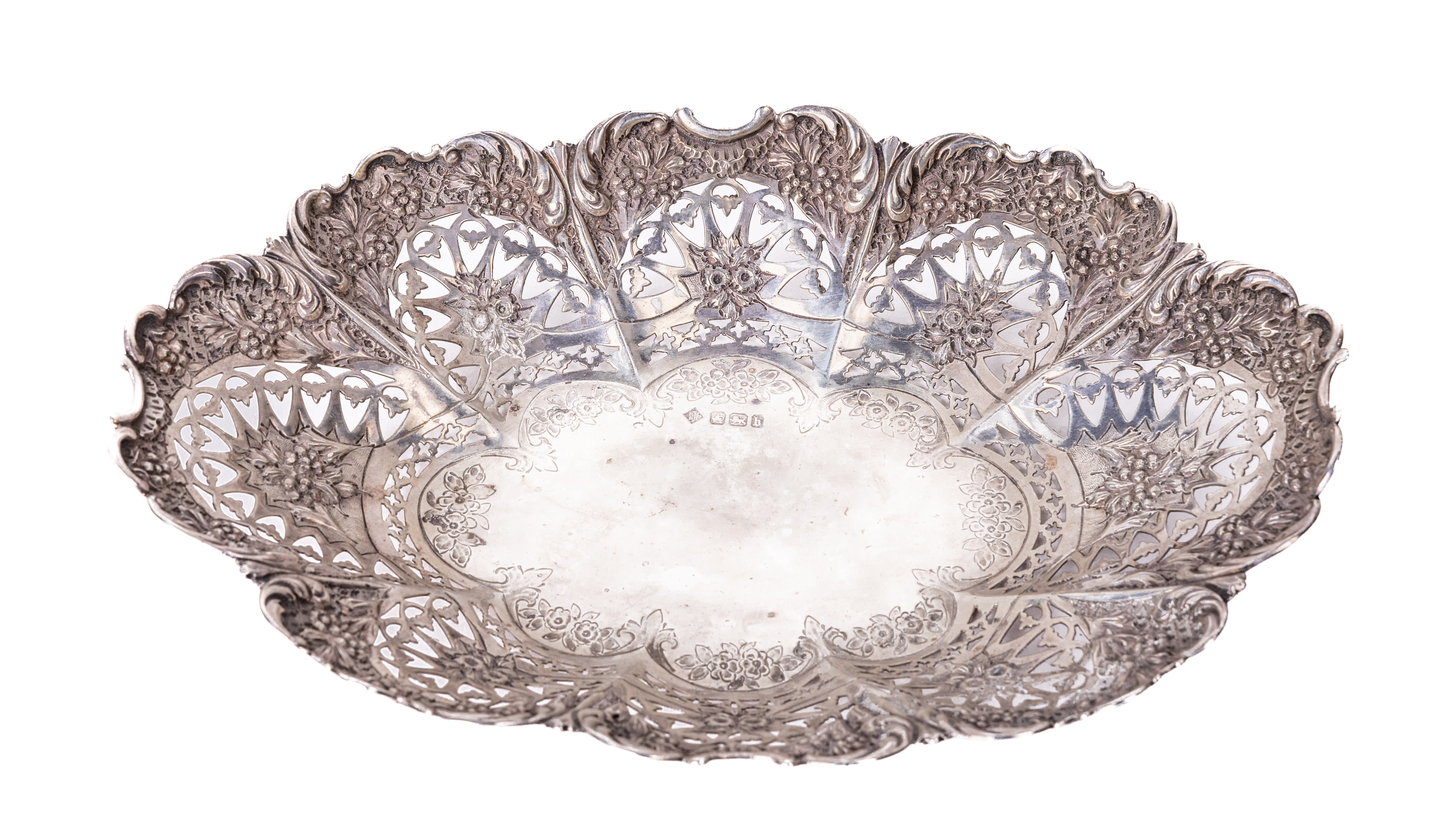 A fine quality English Victorian oval pierced and decorated silver Fruit Dish, with ornate floral
