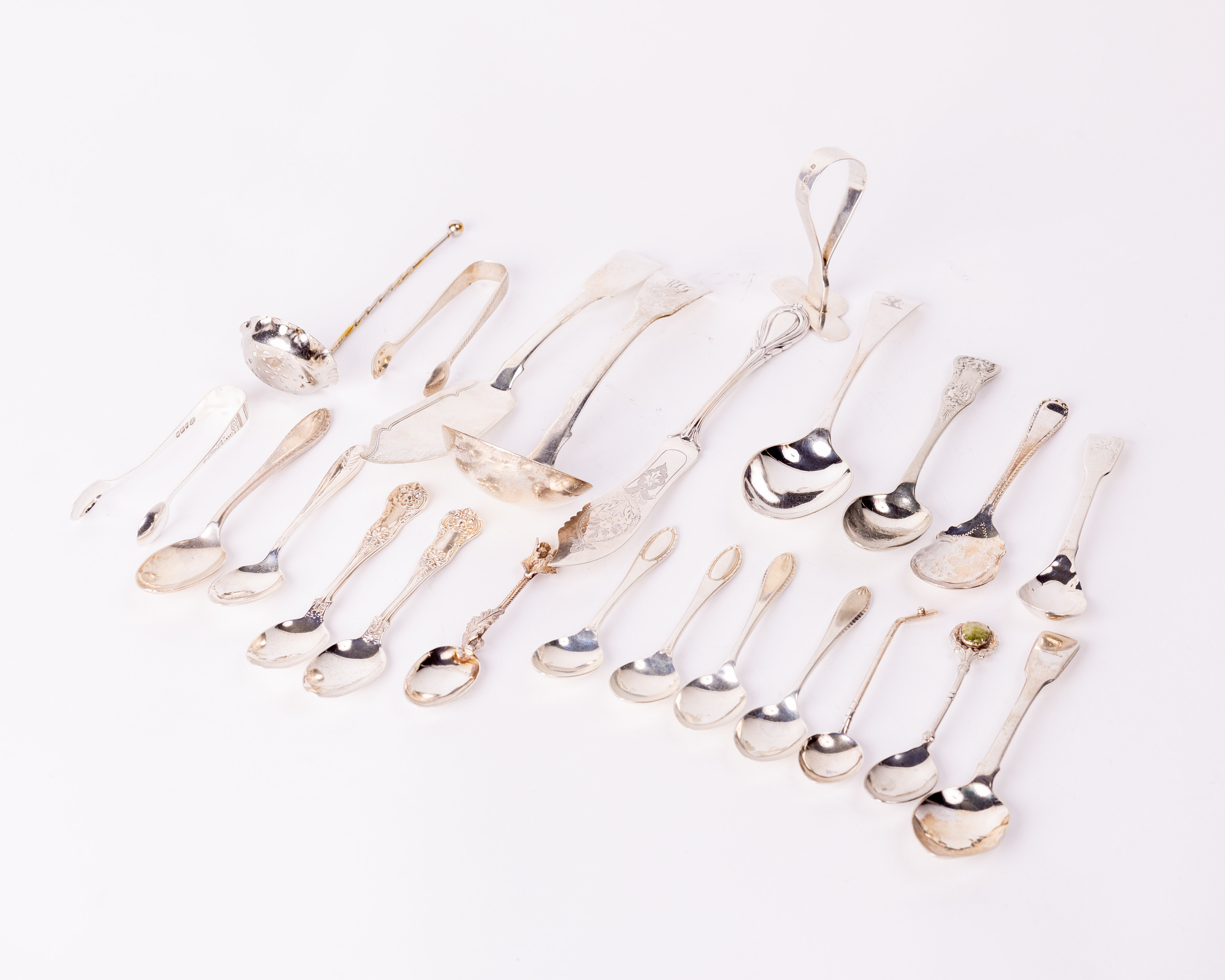 Silverware: A collection of varied silver Novelty Teaspoons, Sauce Ladle, Butter Knives, Miniature