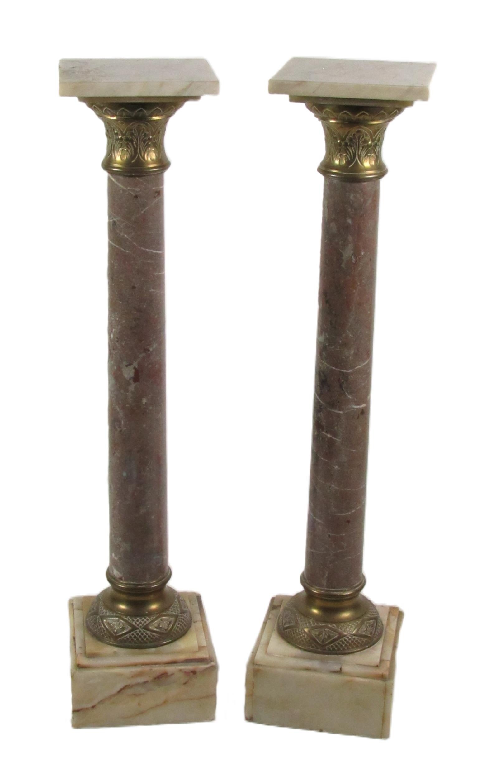 A pair of square top pedestal marble Columns, each with square platform tops, ormolu capitals and