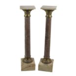 A pair of square top pedestal marble Columns, each with square platform tops, ormolu capitals and
