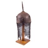 A fine Persian Helmet (Kulah Khud), 19th Century with spike finial on dome head chased with deer