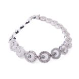 A Ladies 9ct white gold Tennis Bracelet, (15.5grams) set with approx. .4ct of diamonds, hallmarked