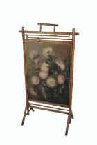 A Victorian bamboo framed Firescreen, with inset floral painting, O.O.C., signed  E. Rice 1894. (
