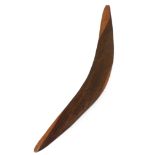 A 20th Century Boomerang, with etched design depicting native birds, approx. 56cms (22") long. (1)