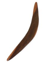 A 20th Century Boomerang, with etched design depicting native birds, approx. 56cms (22") long. (1)