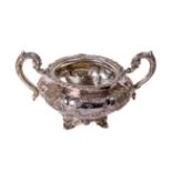 An early 19th Century Irish two handled large silver Sugar Bowl, the decorated edge with ornate