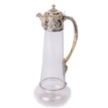 A Victorian silver mounted Claret Jug, of embossed classical design, maker C.E., London c. 1876, the