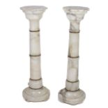 A pair of alabaster Plinths, with octagonal tops on circular bases, each approx. 91cms high (