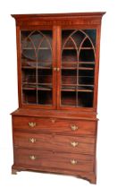 An attractive 19th Century mahogany two door Bookcase, of small proportions, the moulded cornice