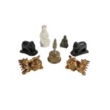 A blanc-de-chine Figure of a Buddha, a pair of carved ebony Elephants, a heavy engraved brass Bell