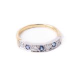 A fine quality sapphire and diamond Ladies Eternity Ring, set with four .06ct diamonds, and three .