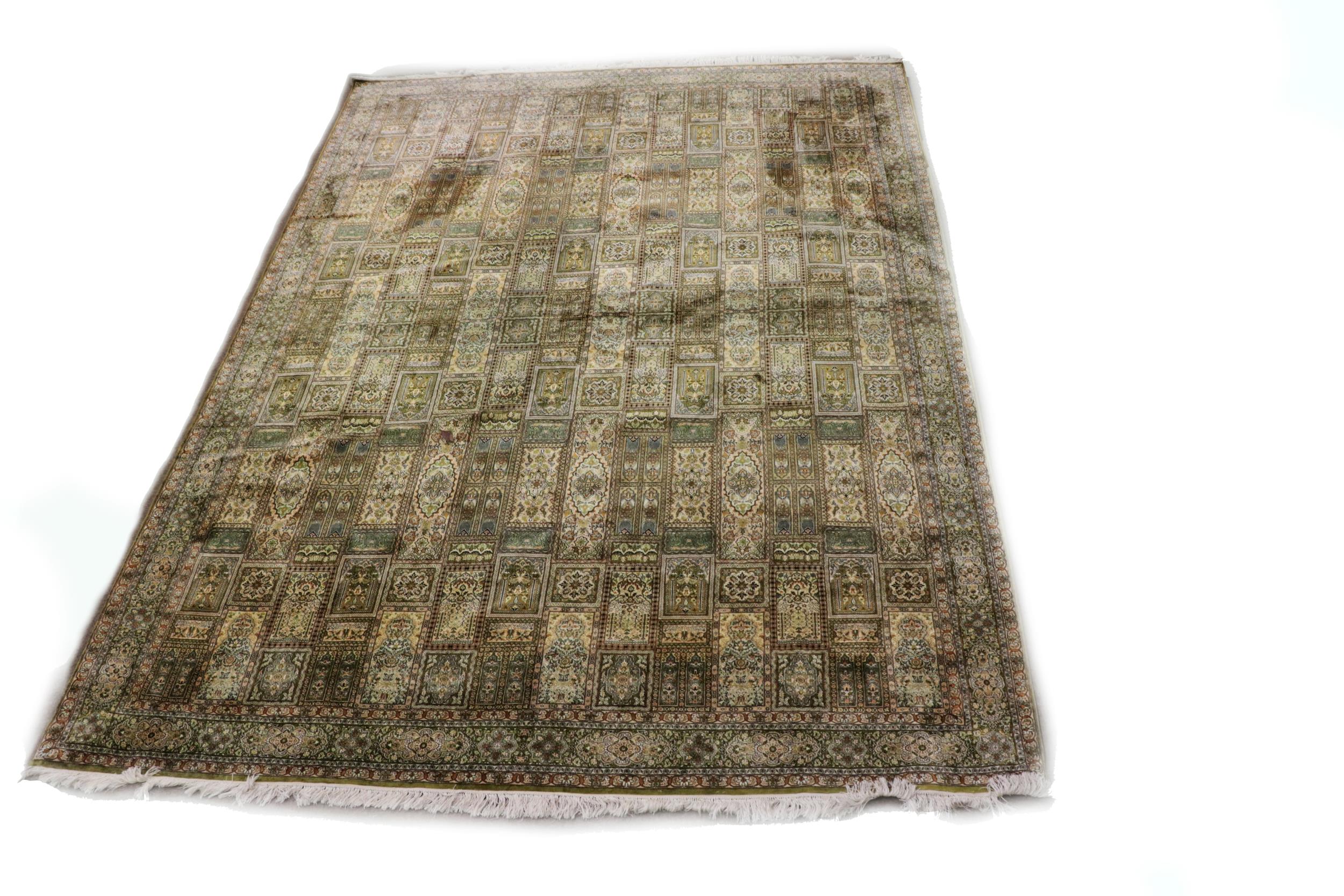 A fine quality Middle Eastern possibly Persian silk Carpet, the central platform with multiple