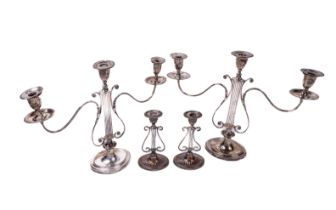 A pair of two branch lyre design three light Victorian silver plated Candlesticks, after George