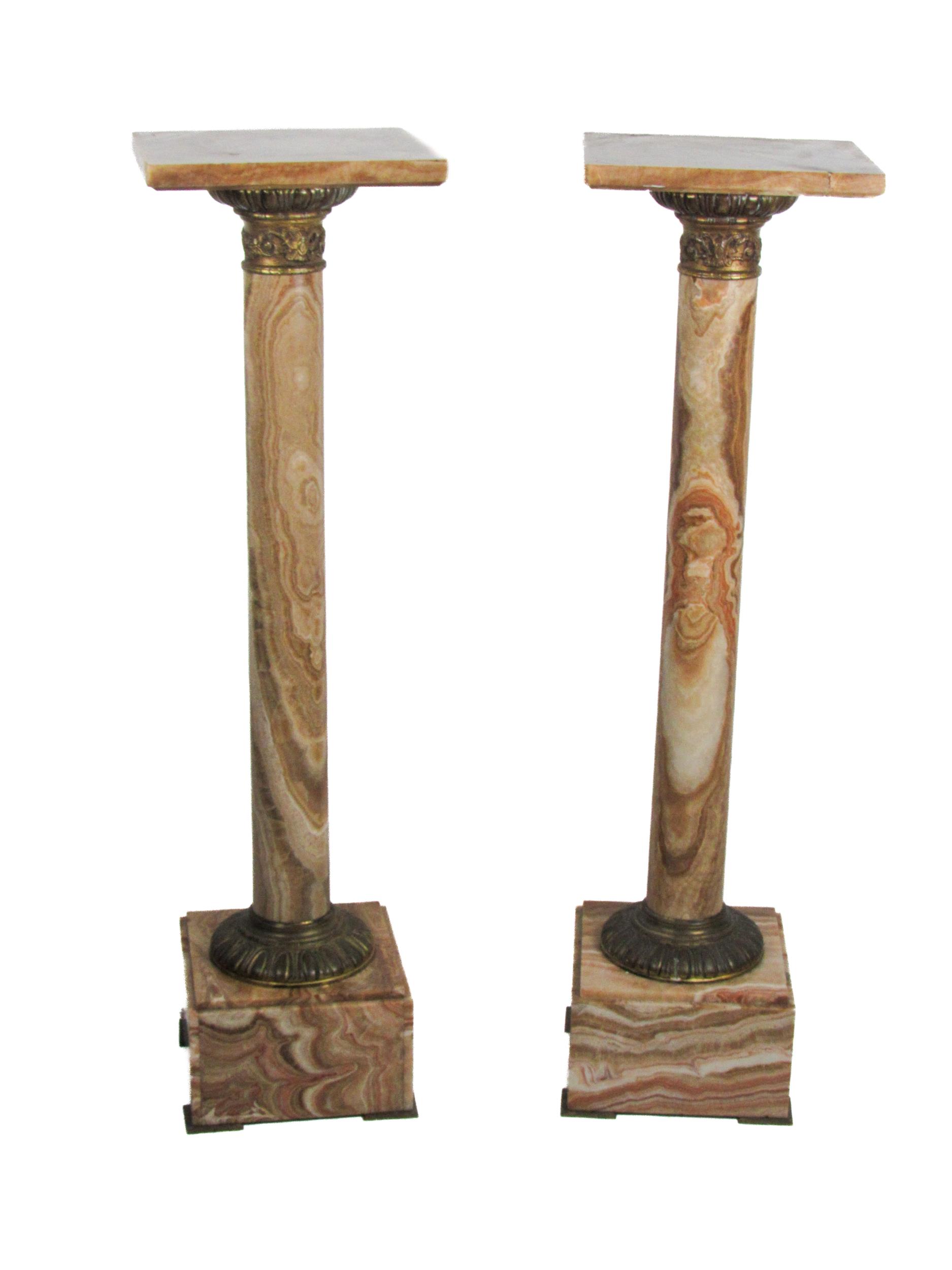 A fine quality pair of marble pillar Stands, the square tops over ormolu tops and bottoms with egg