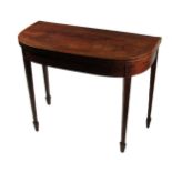 A 19th Century mahogany demi-lune fold-over Card Table, the top with slim border crossbanding and