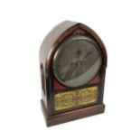 An unusual rosewood cased Regency period arched top Bracket Clock, with circular silvered dial,