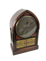 An unusual rosewood cased Regency period arched top Bracket Clock, with circular silvered dial,