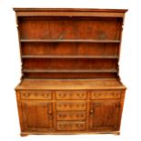 A late 18th Century / early 19th Century oak Dresser, the top with moulded cornice above